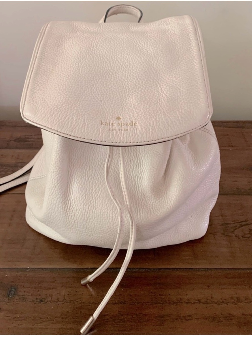 Kate Spade cream off white pebbled leather drawstring backpack purse bag